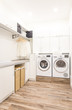 Laundry room with washing machine in modern house
