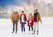 © Syda Productions - people, friendship, sport and leisure concept - happy friends on outdoor skating rink