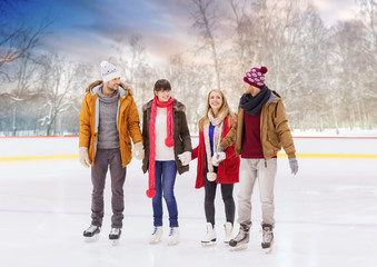 Sticker - people, friendship, sport and leisure concept - happy friends on outdoor skating rink