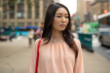 Poster - Asian woman in city walking sad serious face