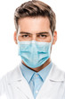 © LIGHTFIELD STUDIOS - serious young male doctor in medical mask looking at camera isolated on white
