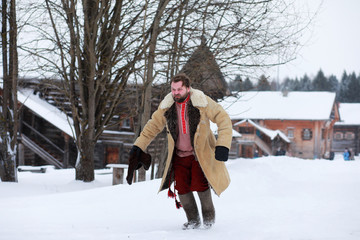 Wall Mural - Traditional winter costume of peasant medieval age in russia