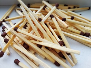 pile of matches on black background