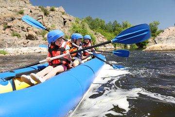 Wall Mural - little children kayaking on river. summer camp