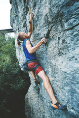 Wall Mural - rock climbing. man rock climber climbing the challenging route on the limestone wall