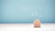 Home Sweet Home, House Wood With Heart Shape On Wooden And Blue Background, Copy Space.