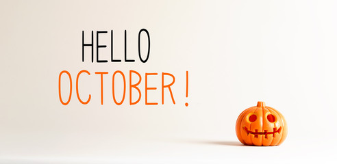hello october with small orange pumpkin lantern