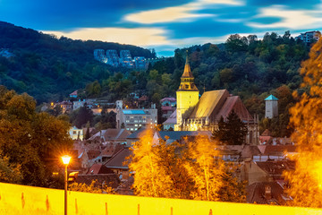 Wall Mural - Cityscape of Brasov in evening lights in fall season, Transylvania region in Romania