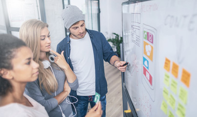 Designers drawing website ux app development.