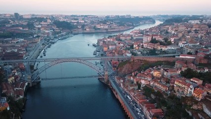 Wall Mural - Aerial view of Douro river and Ribeira, Porto, Portugal. Flying over the old city center.