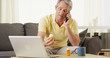 Healthy middle-aged man reading prescription bottle and talking on his cell phone