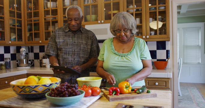 Senior black couple preparing healthy lunch 