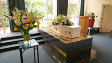 Closeup Shot Of A Funeral Casket In A Hearse Or Chapel Or Burial At Cemetery