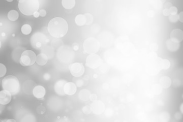 silver bokeh beautiful blurred glitter light on abstract background. grey wallpaper. holiday decorative concept. element for decorative design or advertising. defocused