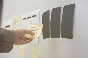 user experience ux designer designing web on smartphone layout. ui planning mobile application. deve