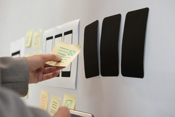 user experience ux designer designing web on smartphone layout. ui planning mobile application. deve