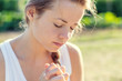 © PhotoGranary - Christian worship and praise. A young woman is praying in the early morning.