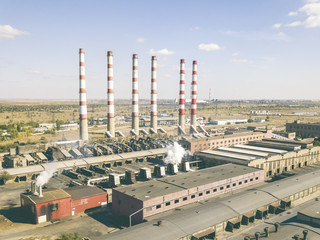 aerial power electrical plant with high industrial pipes on a summer day f