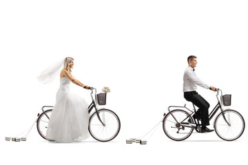 Wall Mural - Young bride riding a bicycle