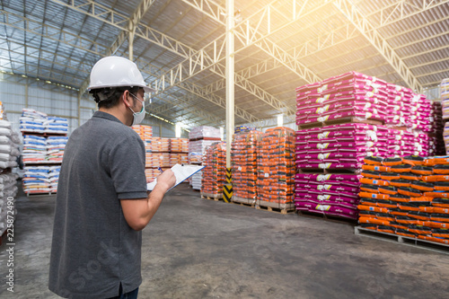 A man is checking the product quality in the warehouse. Warehousing,  quality control, checking of goods, storage of goods. Stock Photo | Adobe  Stock