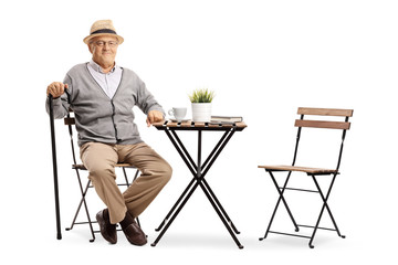 Sticker - Mature man seated at a coffee table