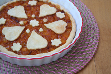 Homemade traditional decorated jelly cake or tart on wooden table
