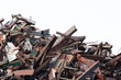 heap of metal scrap isolate on white background, waste automotive steel parts in junk yards.