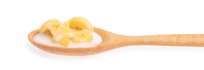 Canvas Print - Cereal with milk on wood spoon isolated on white background.