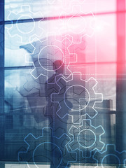 Wall Mural - double exposure gears mechanism on blurred background. business and industrial process automation co