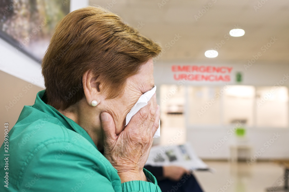 hospital waiting room with people with with mature woman crying Stock ...