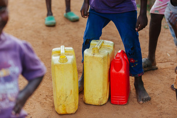 Wall Mural - Water cans in Uganda, Africa