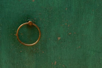 Poster - round iron brown door knob on the green wall