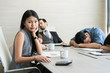 © Prasit Rodphan - Bored business people and sleeping resting on workplace during work meeting, concept of exhausted businesspeople bored sleep tired.