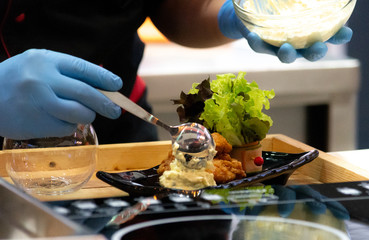 Chef preparing food, meal, in the kitchen, chef cooking, Chef decorating dish, closeup, .chef at work.