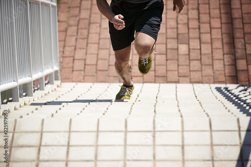 Fotografie, Obraz young asian male athlete training on steps