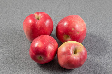 Wall Mural - red apples on a grey background