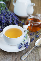 Wall Mural - Cup of tea and honey with lavender flowers