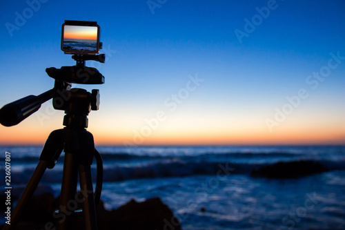 Fotografie, Obraz Action camera capturing a sunrise on "Las Rotas" beach in Denia, Spain