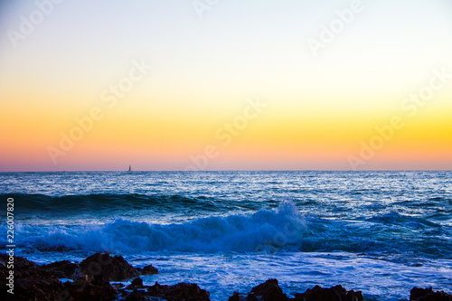 Foto Sunrise on "Las Rotas" beach in Denia, Spain