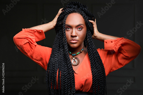 Girl In Red Clothes On A Black Background Stylish Hairstyle