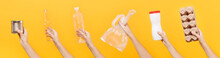 Close Up Hands Hold Set Of Recycling Paper Plastic Glass Metal Objects Isolated On Yellow Background. Stop Nature Garbage, Ecology Environment Protection Concept. Save Planet Packaging Template Mockup