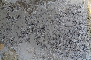 Beautiful frost and ice pattern on window surface.