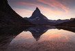 The famous Matterhorn reflected in the Riffelsee and during a cool sunet in Switzerland.
