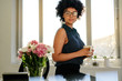 © Jacob Lund - Confident woman in office with coffee