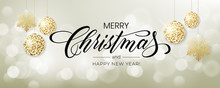 Merry Christmas Background With Blur Bokeh Light Effect. Lettering Merry Christmas And Happy New Year