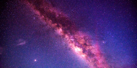 night sky milky way and star on dark background.Universe filled with stars, nebula and galaxy with noise and grain.Photo by long exposure and select white balance.