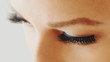© Olesia - Female eye with extreme long false eyelashes. Eyelash extensions, make-up, cosmetics, beauty and skin care