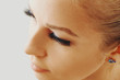© Olesia - Beautiful girl with long false eyelashes and perfect skin. Eyelash extensions, cosmetology, beauty and skin care