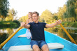 © Pixel-Shot - Cute young couple having romantic date in boat