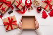 © Prostock-studio - Woman hands holding empty Christmas gift box